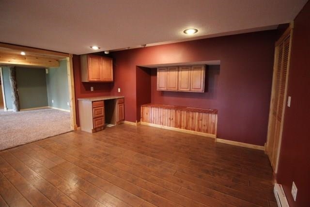 742 North River Road Ridott, IL 61067 - Photo 18 of 25 a view of an empty room with a kitchen