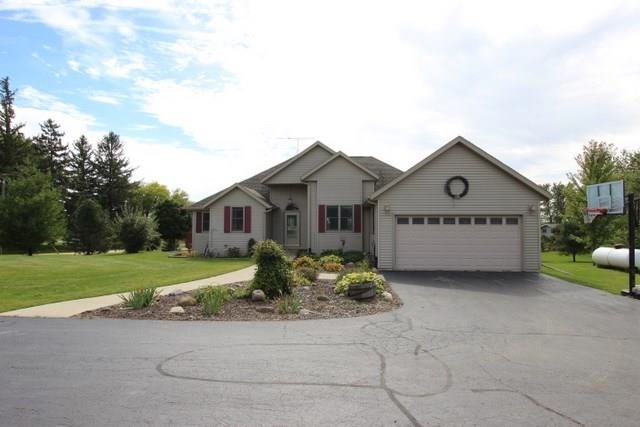 742 North River Road Ridott, IL 61067 - Photo 21 of 25 a view of a house with a yard and large trees