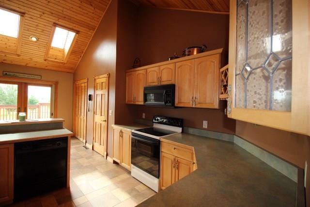 742 North River Road Ridott, IL 61067 - Photo 9 of 25 a kitchen with stainless steel appliances granite countertop a sink and a stove