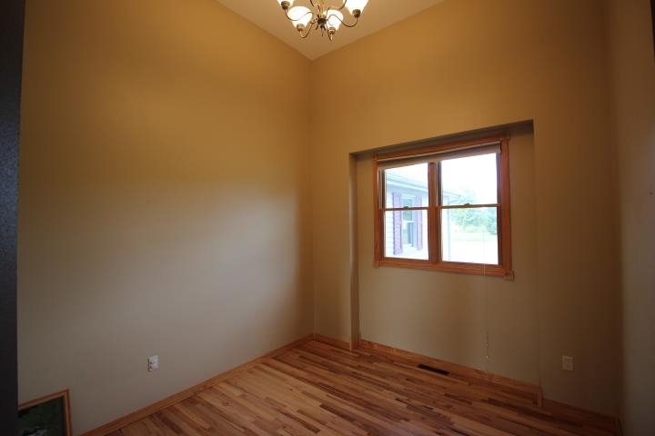 742 North River Road Ridott, IL 61067 - Photo 10 of 25 a view of an empty room with a window