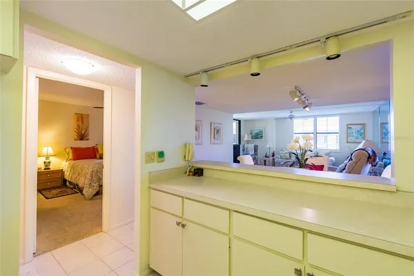 a view of a kitchen with dining table and chairs