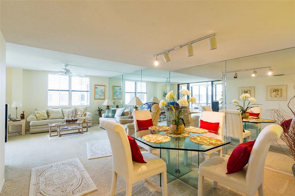 8767 Midnight Pass Road, Unit 506F Sarasota, FL 34242 - Photo 14 of 37 a view of a dining room with furniture