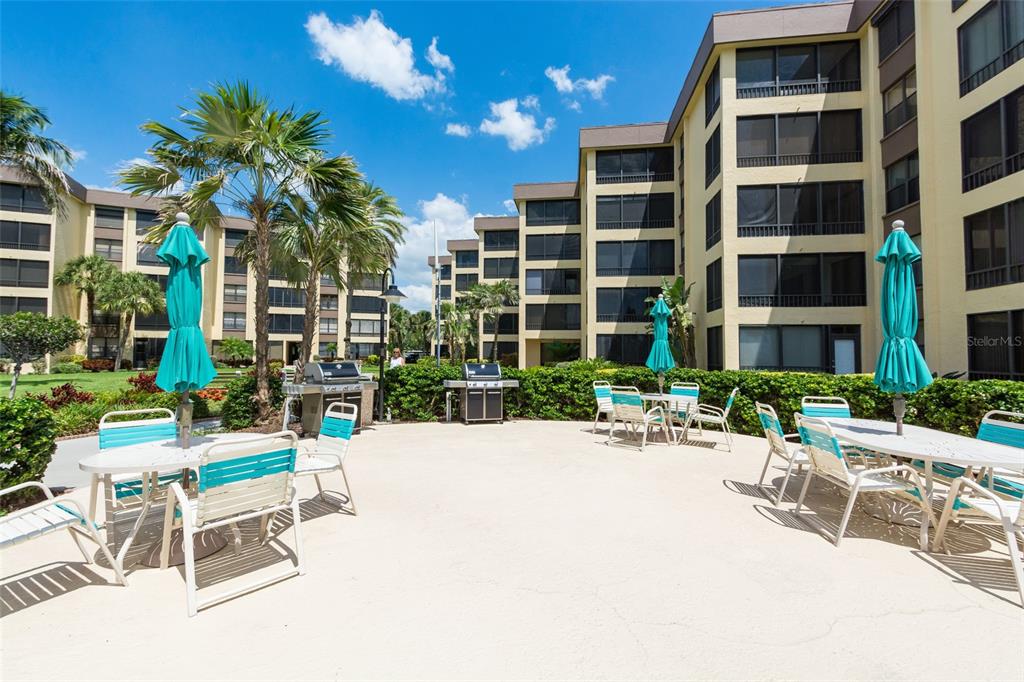 8767 Midnight Pass Road, Unit 506F Sarasota, FL 34242 - Photo 29 of 37 a building view with a outdoor space