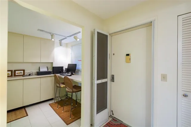 a kitchen with a sink appliances and cabinets