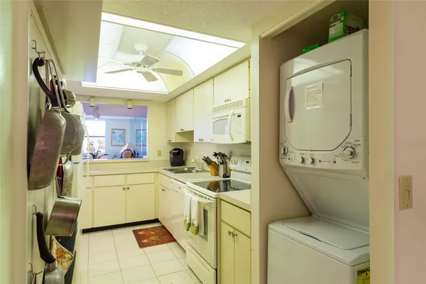 a room with a washing machine and sink