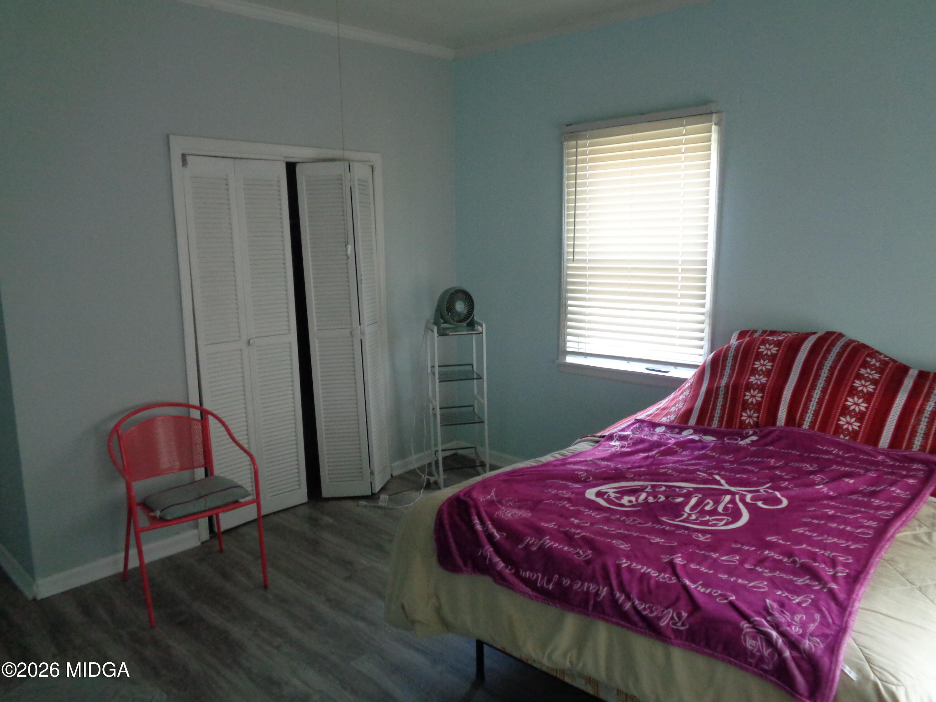 3380 Goodwin Lane Macon, GA 31217 - Photo 13 of 22 a bedroom with a bed a table and chair