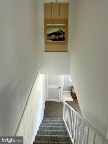 a view of a hallway with stairs