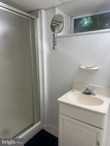 a bathroom with a sink and mirror