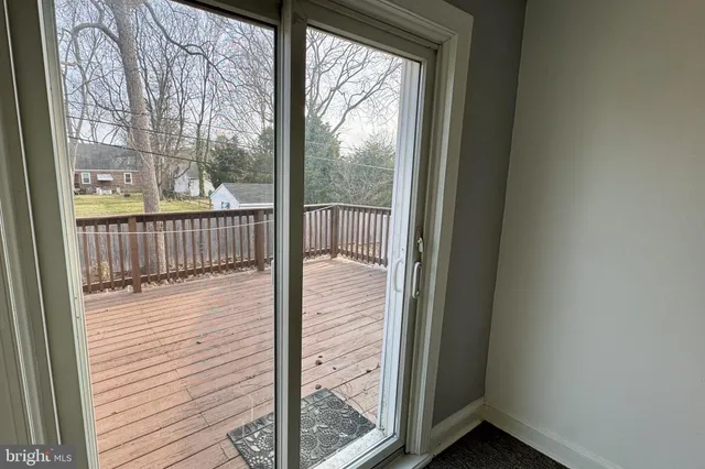 a view of a balcony with wooden floor