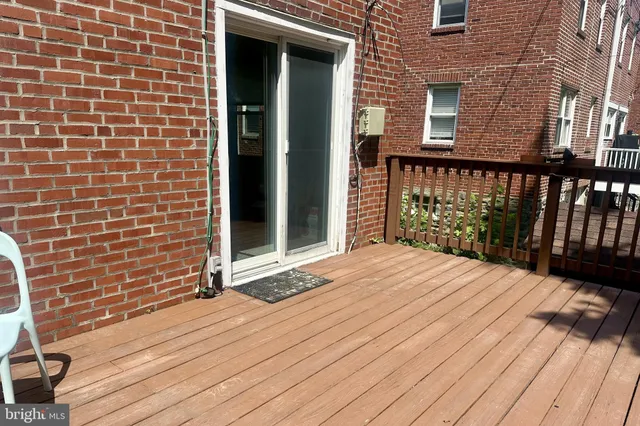 a view of a brick house with wooden floor