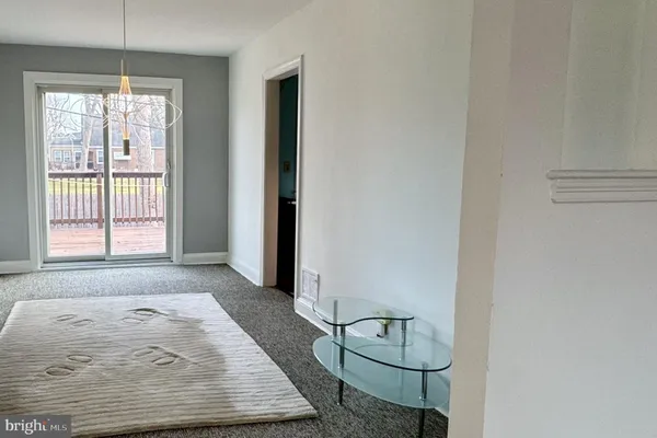 a view of room with window and hardwood floor