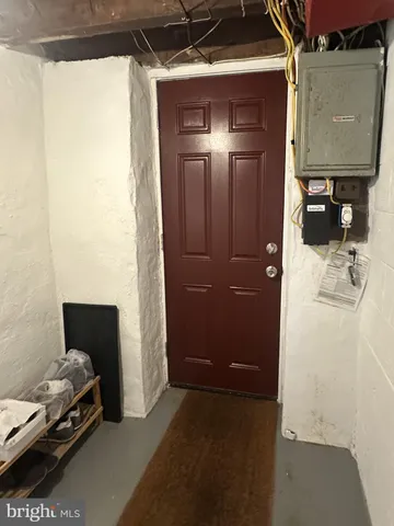 a view of bedroom with furniture and a shower