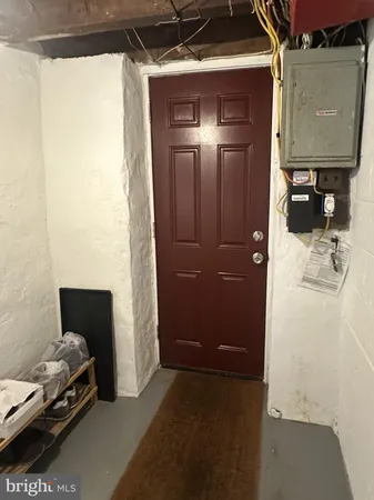 a view of bedroom with furniture and a shower
