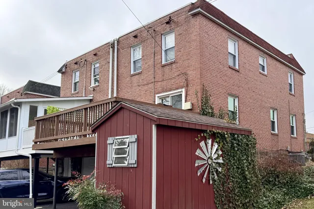 a front view of residential houses with stairs