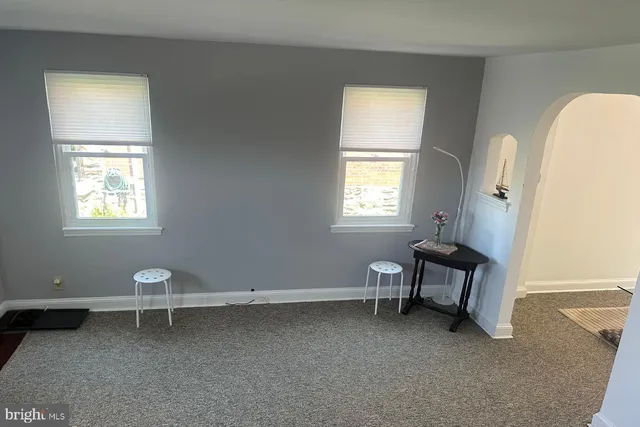 a room with a window and a chair