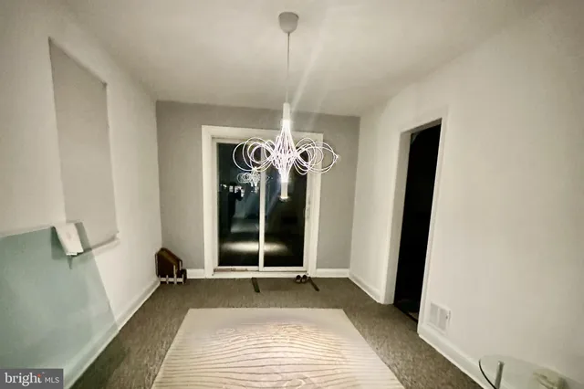 a view of a livingroom with a bathroom and sink