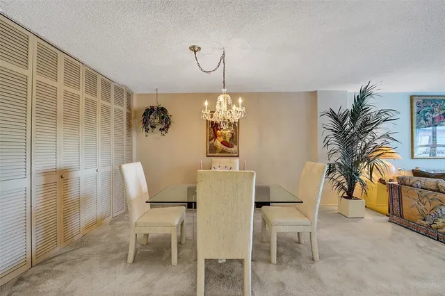 a living room with furniture and a book shelf