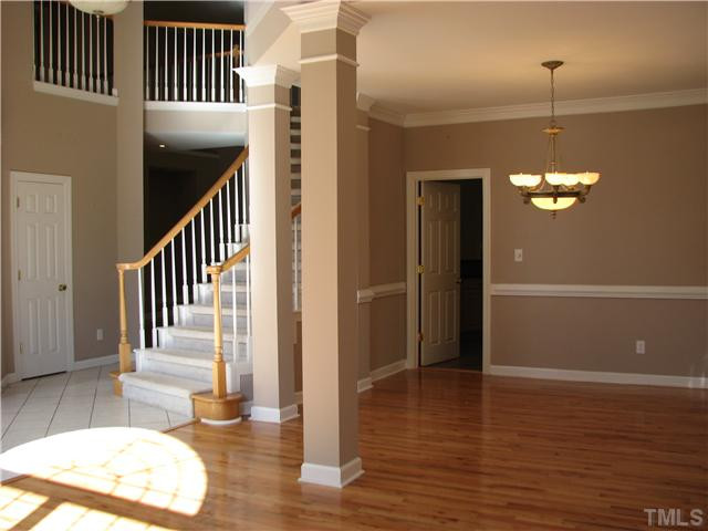 5029 Bartons Enclave Lane Raleigh, NC 27613 - Photo 10 of 25 This is a view from the living room as it opens to the foyer and the dining room.