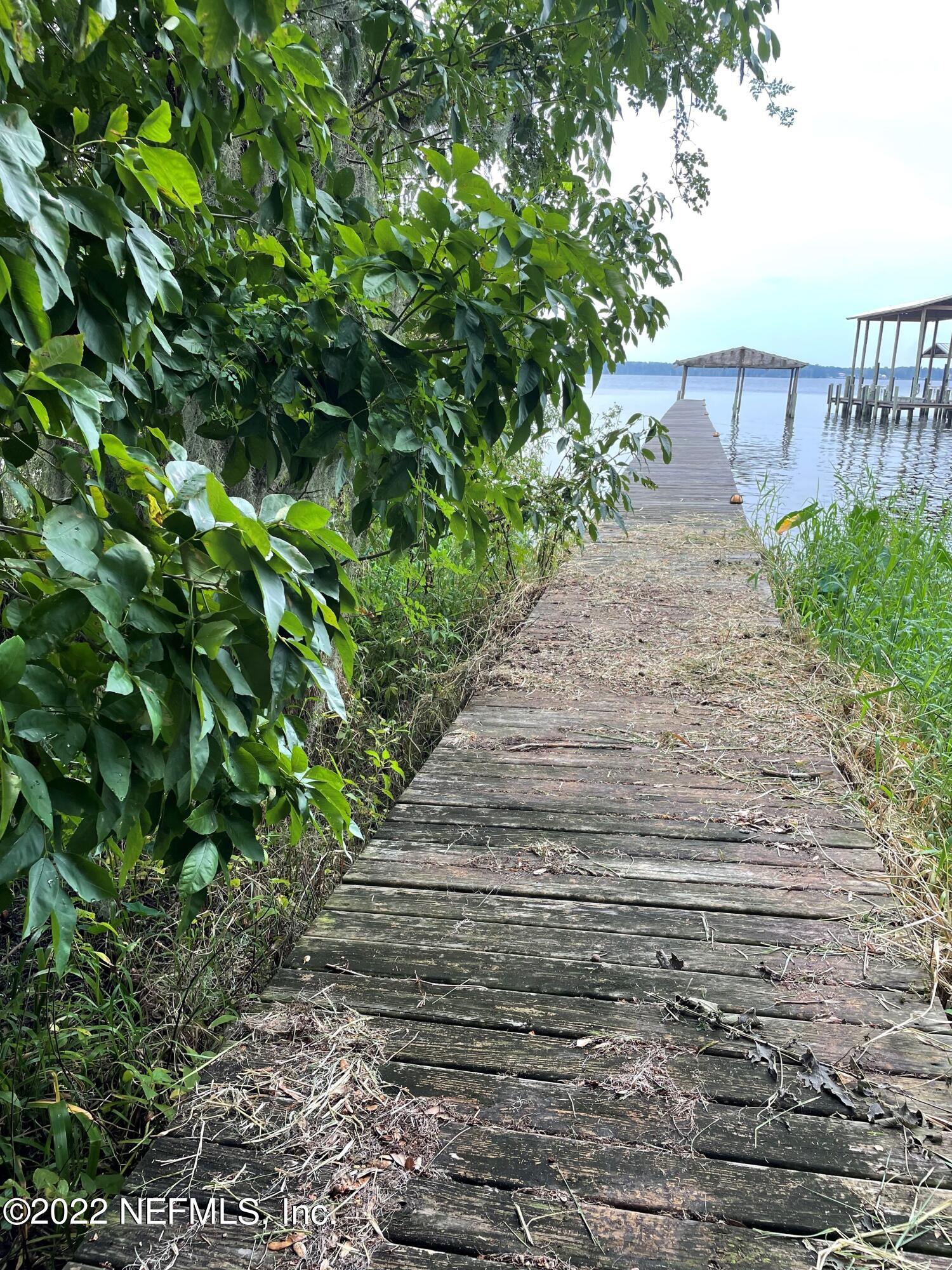 8317 Colee Cove Road St. Augustine, FL 32092 - Photo 7 of 9 a view of a pathway with a garden