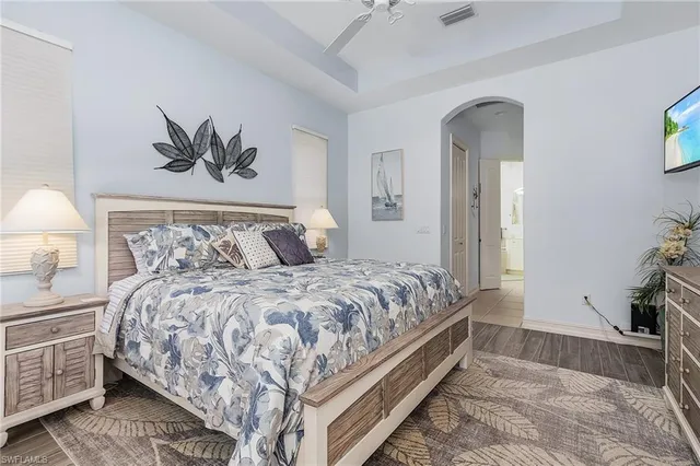 a bedroom with a bed and a couch