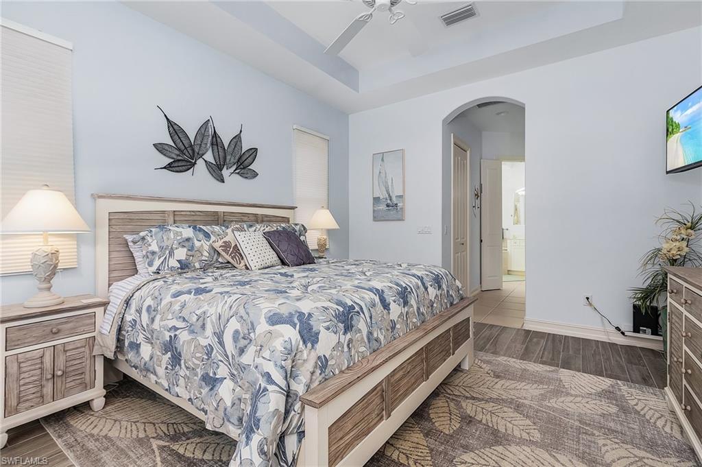 12595 Grandezza Circle Estero, FL 33928 - Photo 11 of 33 a bedroom with a bed and a couch