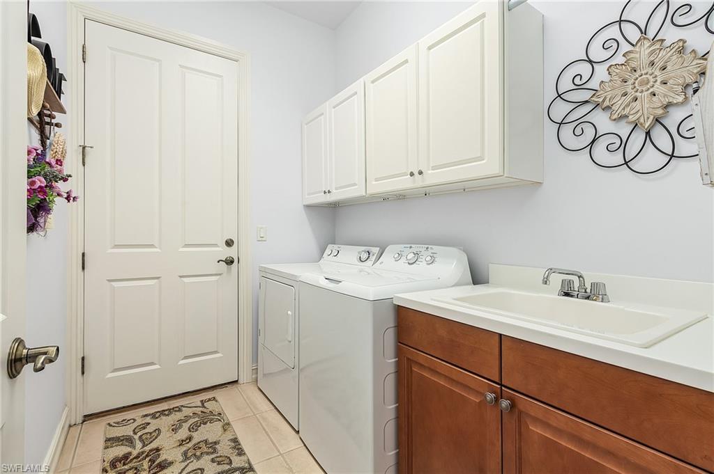 12595 Grandezza Circle Estero, FL 33928 - Photo 16 of 33 a utility room with a sink
