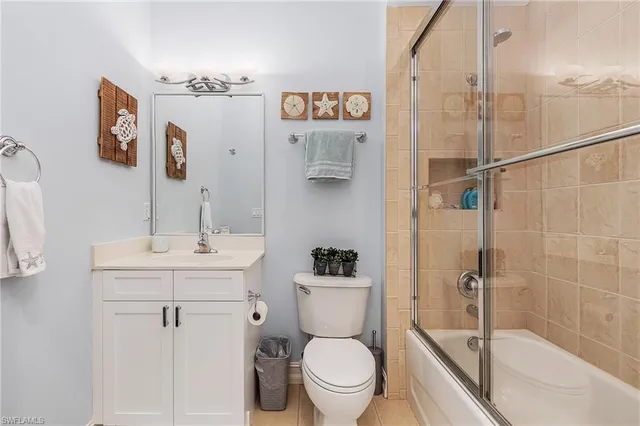 a bathroom with a toilet sink and shower