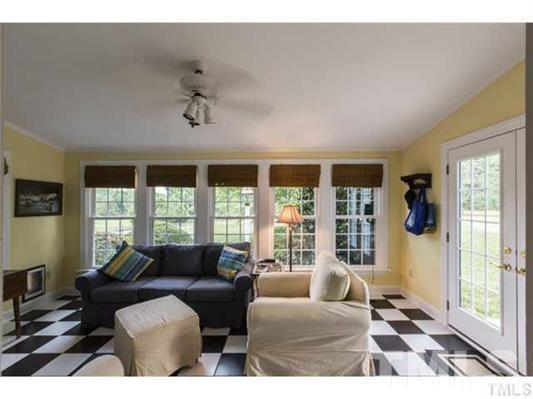9123 South Lowell Road Bahama, NC 27503 - Photo 11 of 25 a living room with furniture and large windows