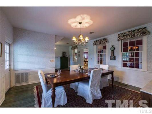 9123 South Lowell Road Bahama, NC 27503 - Photo 14 of 25 a dining room with furniture and chandelier