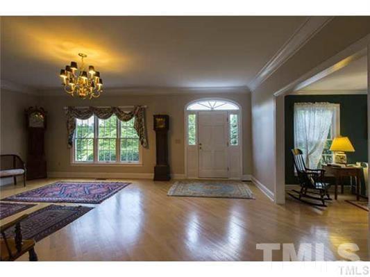 9123 South Lowell Road Bahama, NC 27503 - Photo 6 of 25 a view of a livingroom with furniture and a window