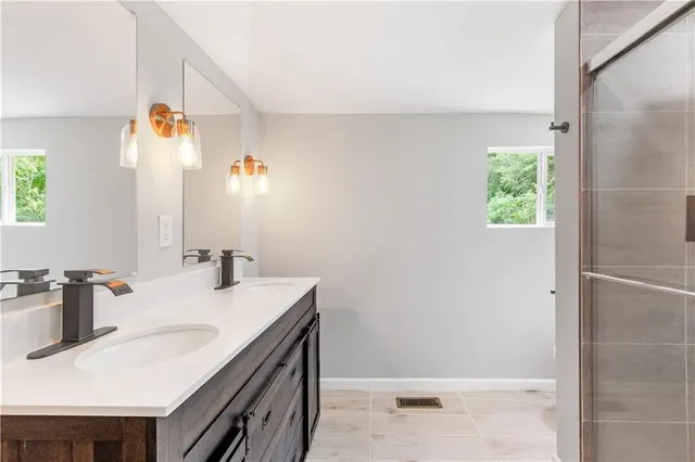 a bathroom with a sink and a mirror