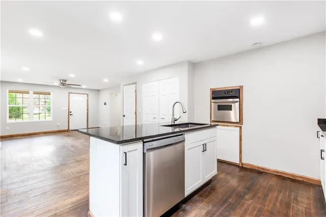a kitchen with a sink and cabinets