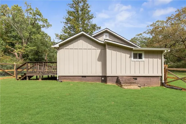 a balcony with wooden floor and fence