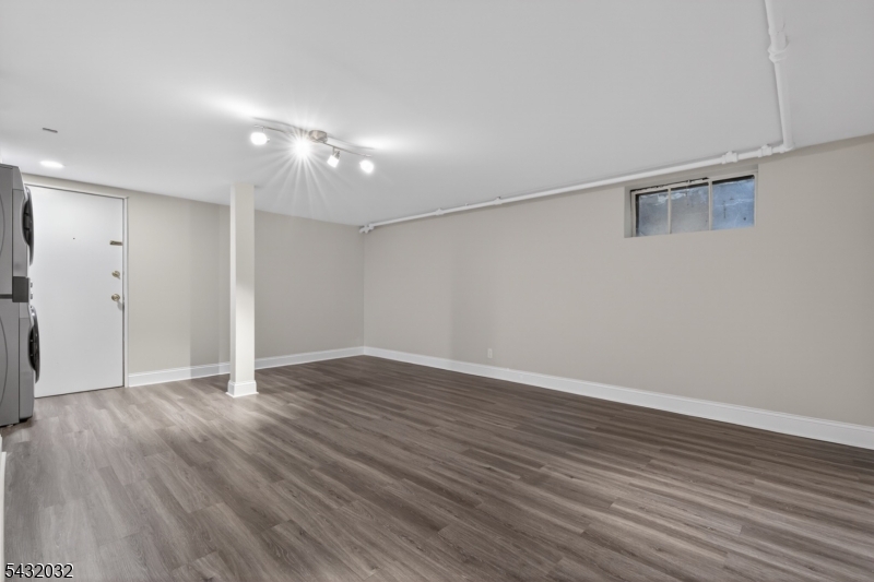 180 Summit Avenue, Unit B Summit, NJ 07901 - Photo 13 of 15 a view of an empty room with wooden floor