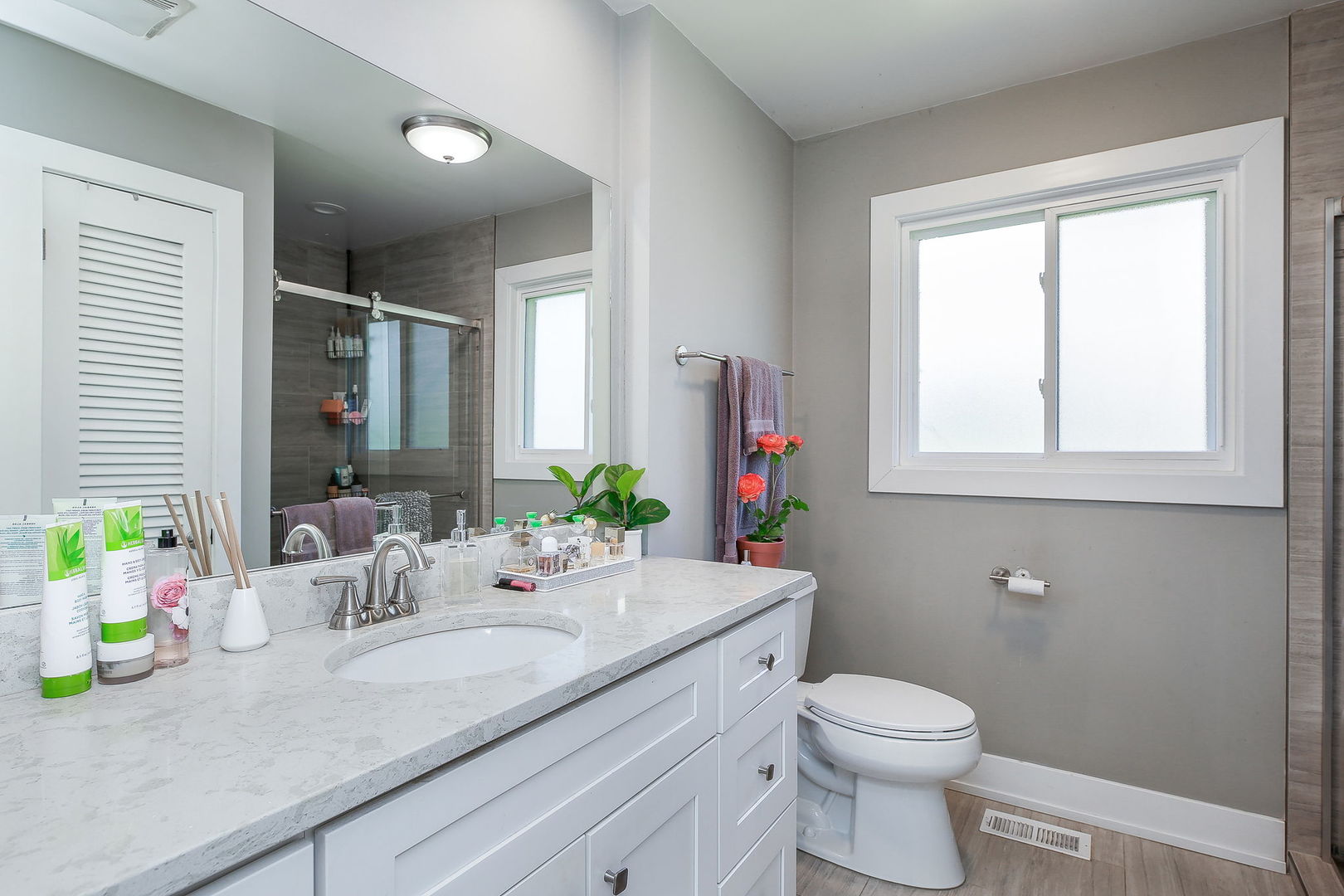 3309 York Road Oak Brook, IL 60523 - Photo 12 of 18 a bathroom with a granite countertop sink vanity mirror and toilet