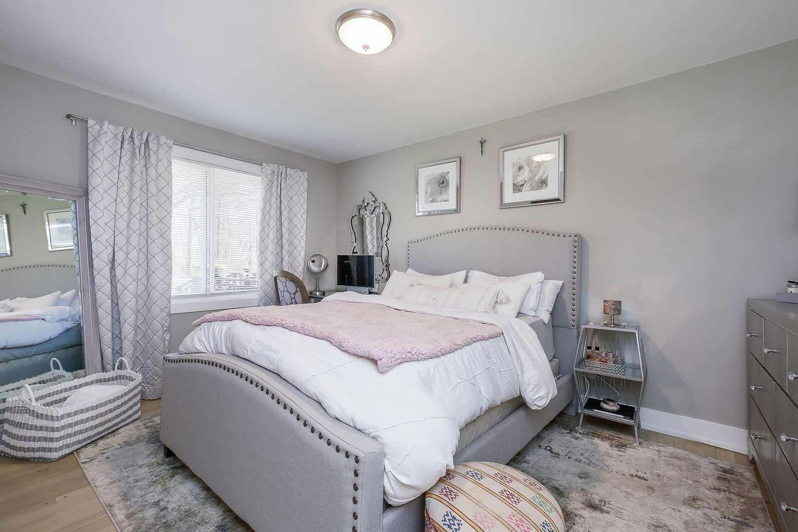 3309 York Road Oak Brook, IL 60523 - Photo 13 of 18 a bedroom with a bed and a chair