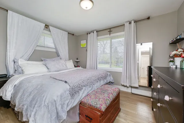 a bedroom with a bed and a dresser