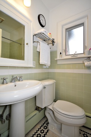 85 Akenside Road Riverside, IL 60546 - Photo 16 of 24 a bathroom with a sink a toilet and mirror