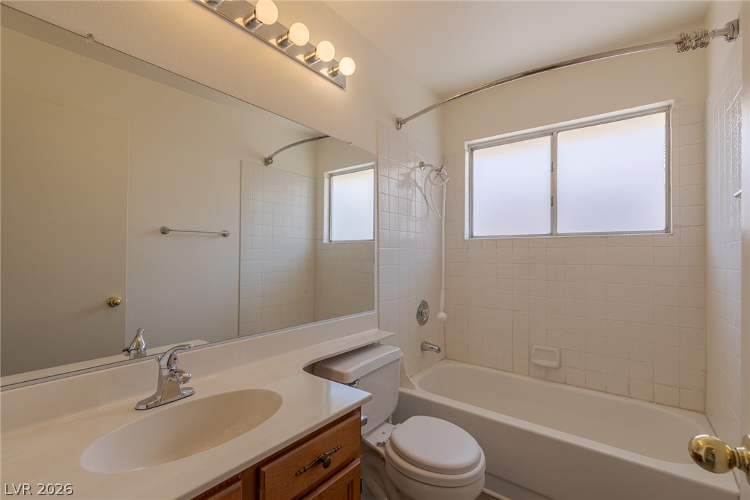 2803 Mirage Road Henderson, NV 89074 - Photo 26 of 39 A classic bathtub and tile surround complement the vanity in this functional bathroom.