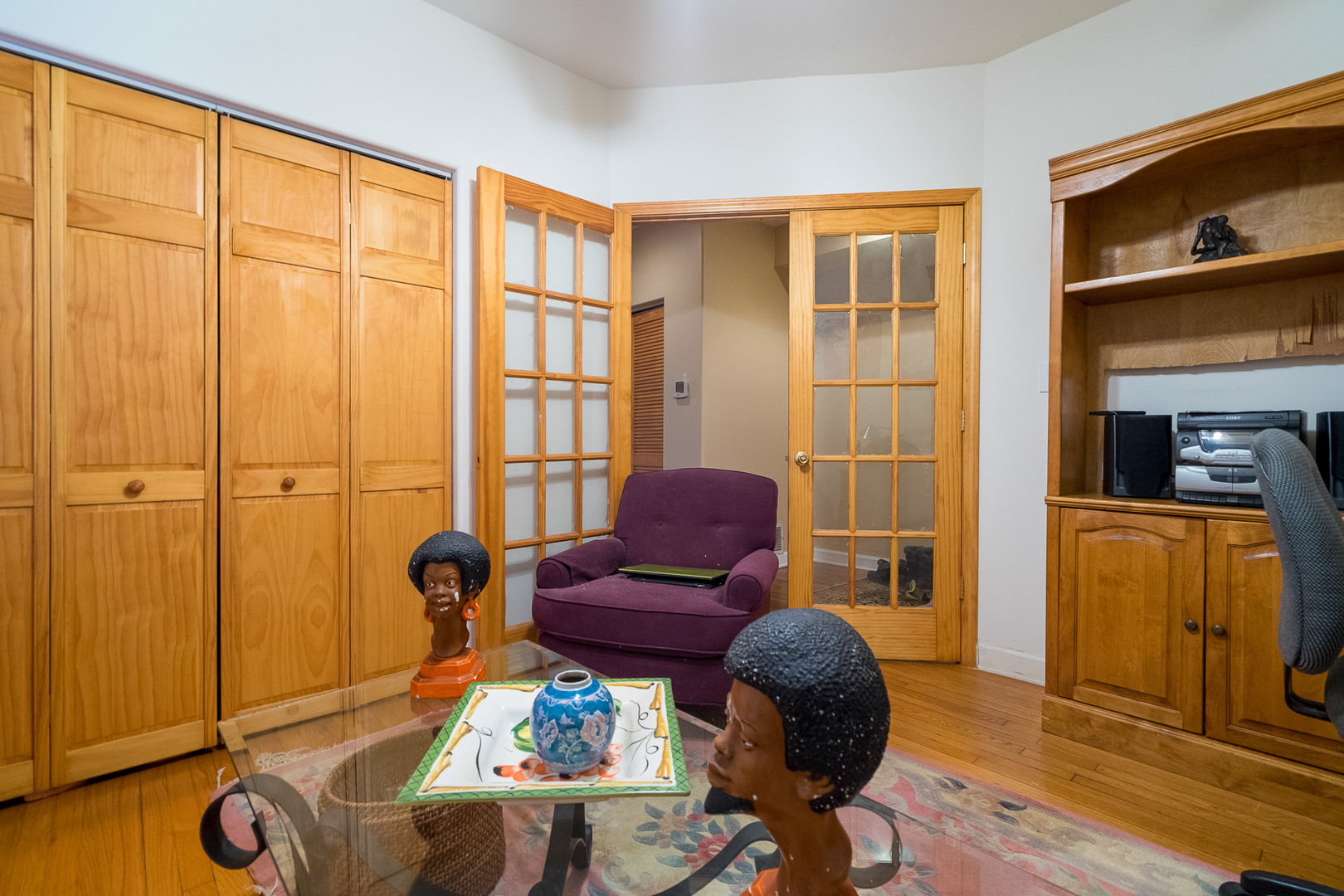 7645 South Yates Boulevard, Unit 1S Chicago, IL 60649 - Photo 11 of 23 a living room with furniture and wooden floor