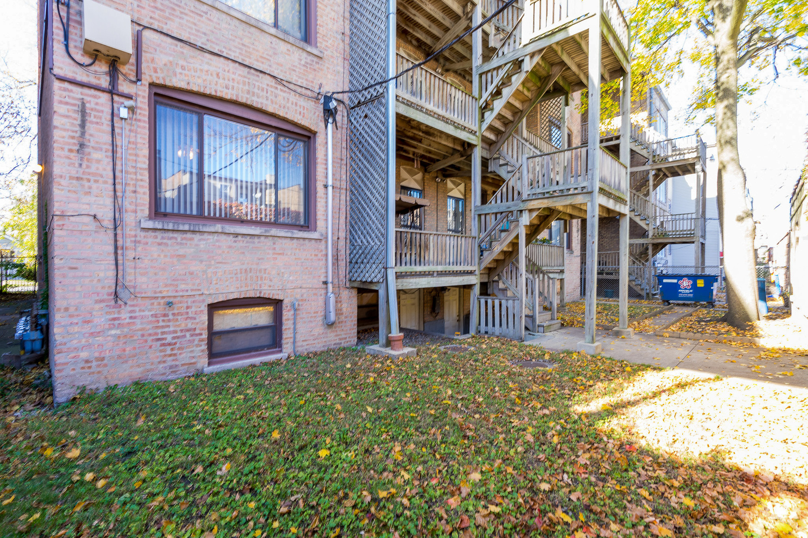 7645 South Yates Boulevard, Unit 1S Chicago, IL 60649 - Photo 20 of 23 a view of a brick building with many windows