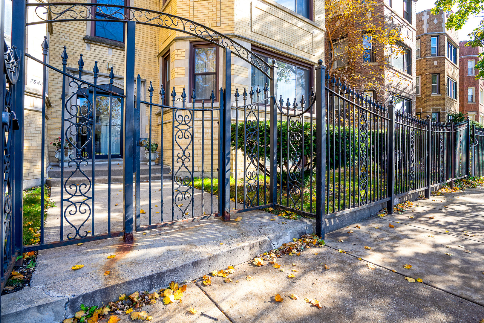 7645 South Yates Boulevard, Unit 1S Chicago, IL 60649 - Photo 22 of 23 a view of a entrance gate of the house and a street