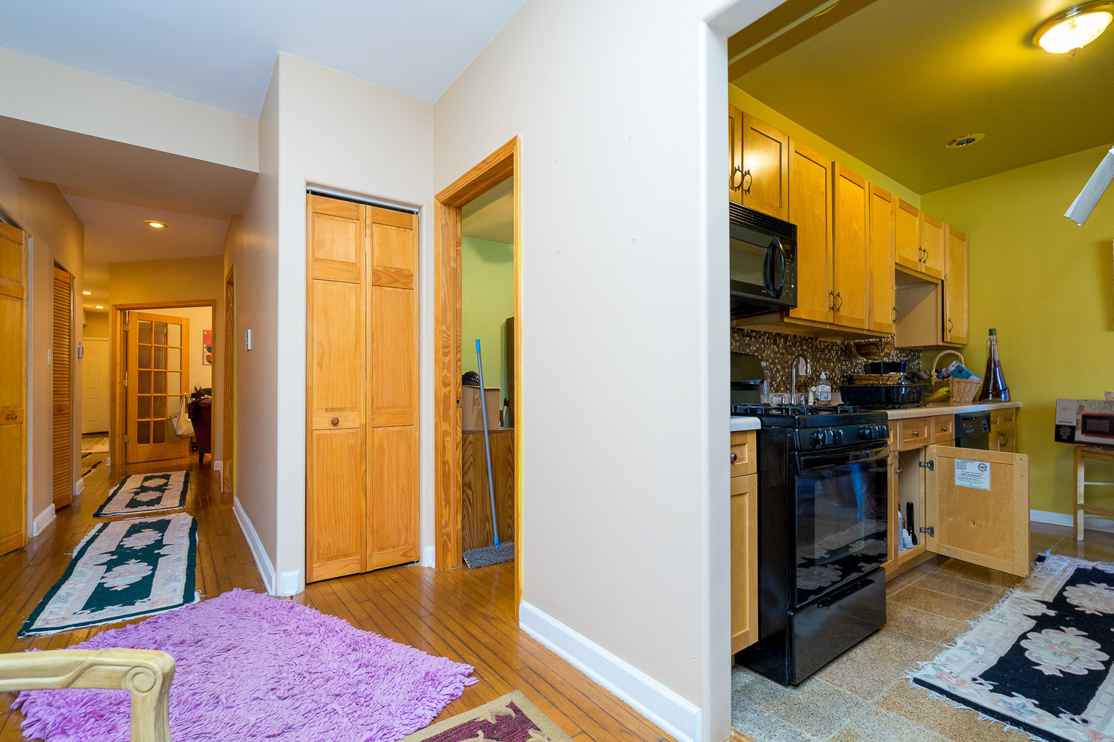 7645 South Yates Boulevard, Unit 1S Chicago, IL 60649 - Photo 8 of 23 a view of a bedroom with bathroom and front door