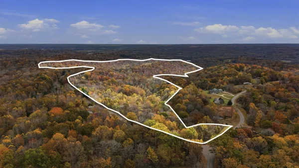 an aerial view of residential building and green space