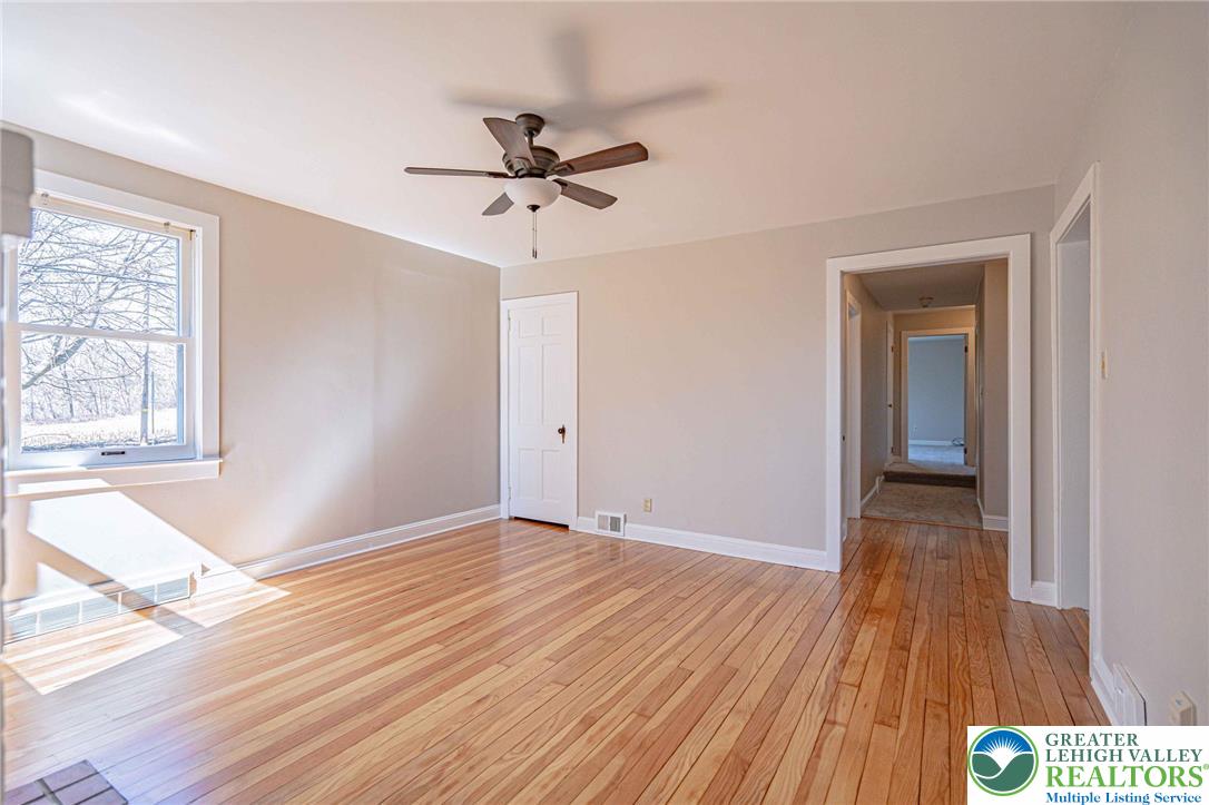 6245 Vera Cruz Road Emmaus, PA 18049 - Photo 11 of 72 wooden floor in an empty room with a window