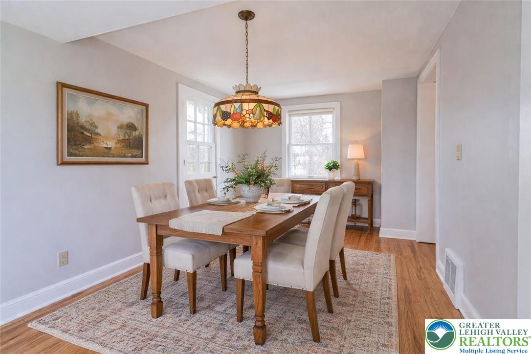 6245 Vera Cruz Road Emmaus, PA 18049 - Photo 14 of 72 a view of a dining room with furniture window and wooden floor