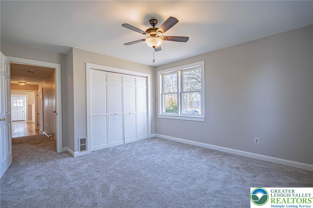 6245 Vera Cruz Road Emmaus, PA 18049 - Photo 26 of 72 a view of an empty room with a ceiling fan