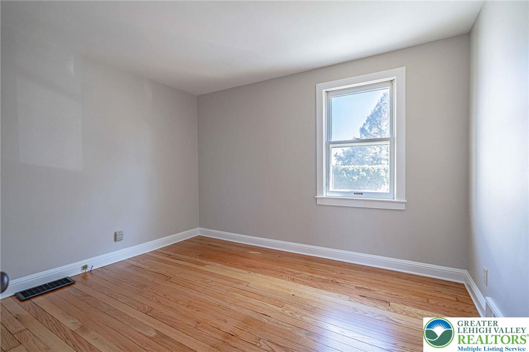 6245 Vera Cruz Road Emmaus, PA 18049 - Photo 34 of 72 a view of empty room with wooden floor and fan