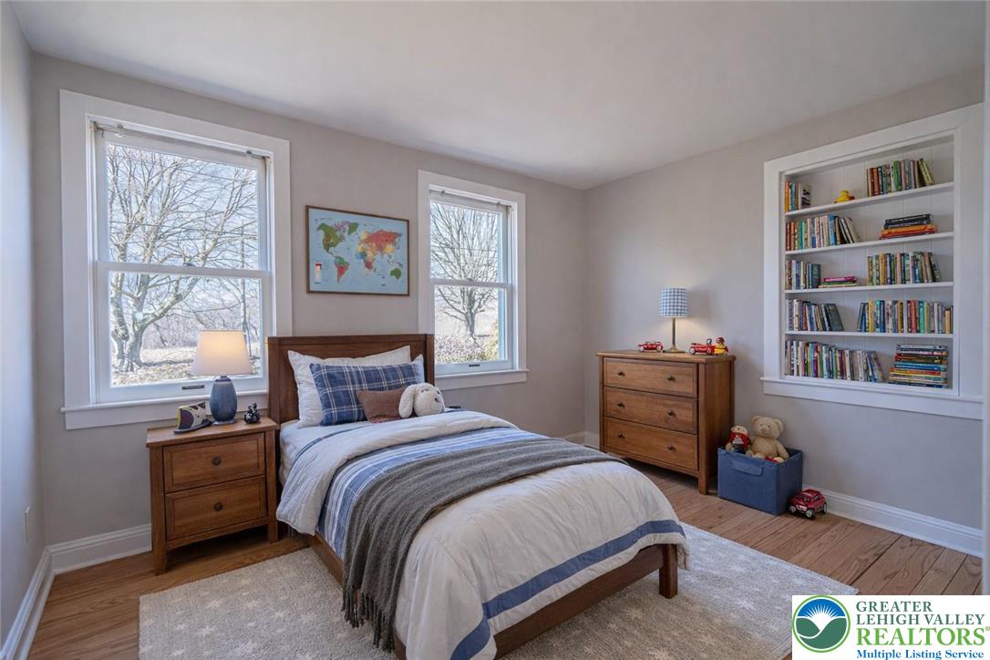 6245 Vera Cruz Road Emmaus, PA 18049 - Photo 39 of 72 a bedroom with a bed dresser and a window