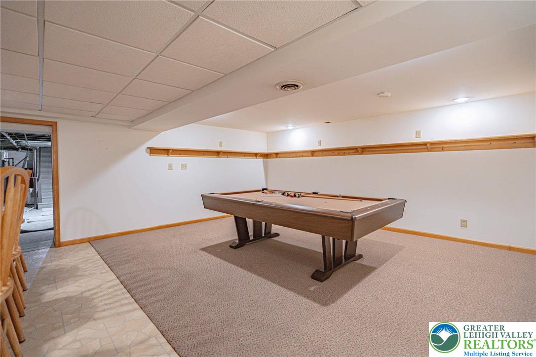 6245 Vera Cruz Road Emmaus, PA 18049 - Photo 54 of 72 a living room with furniture and a table